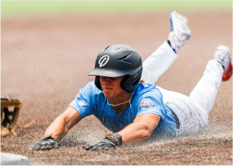 Photo of player sliding into a base